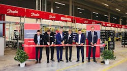 The Danfoss ribbon-cutting ceremony was attended by over 100 people, including customers, community members, Danfoss President and CEO Kim Fausing and descendants of Danfoss founder Mads Clausen. The Danfoss ribbon-cutting ceremony was attended by over 100 people, including customers, community members, Danfoss President and CEO Kim Fausing and descendants of Danfoss founder Mads Clausen.