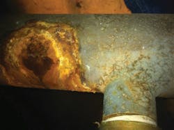 This photo shows damage done to piping from acidic condensate. This photo shows damage done to piping from acidic condensate.