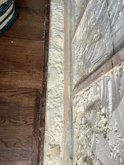 The joist cavity after being sealed and filled with spray foam. The joist cavity after being sealed and filled with spray foam.