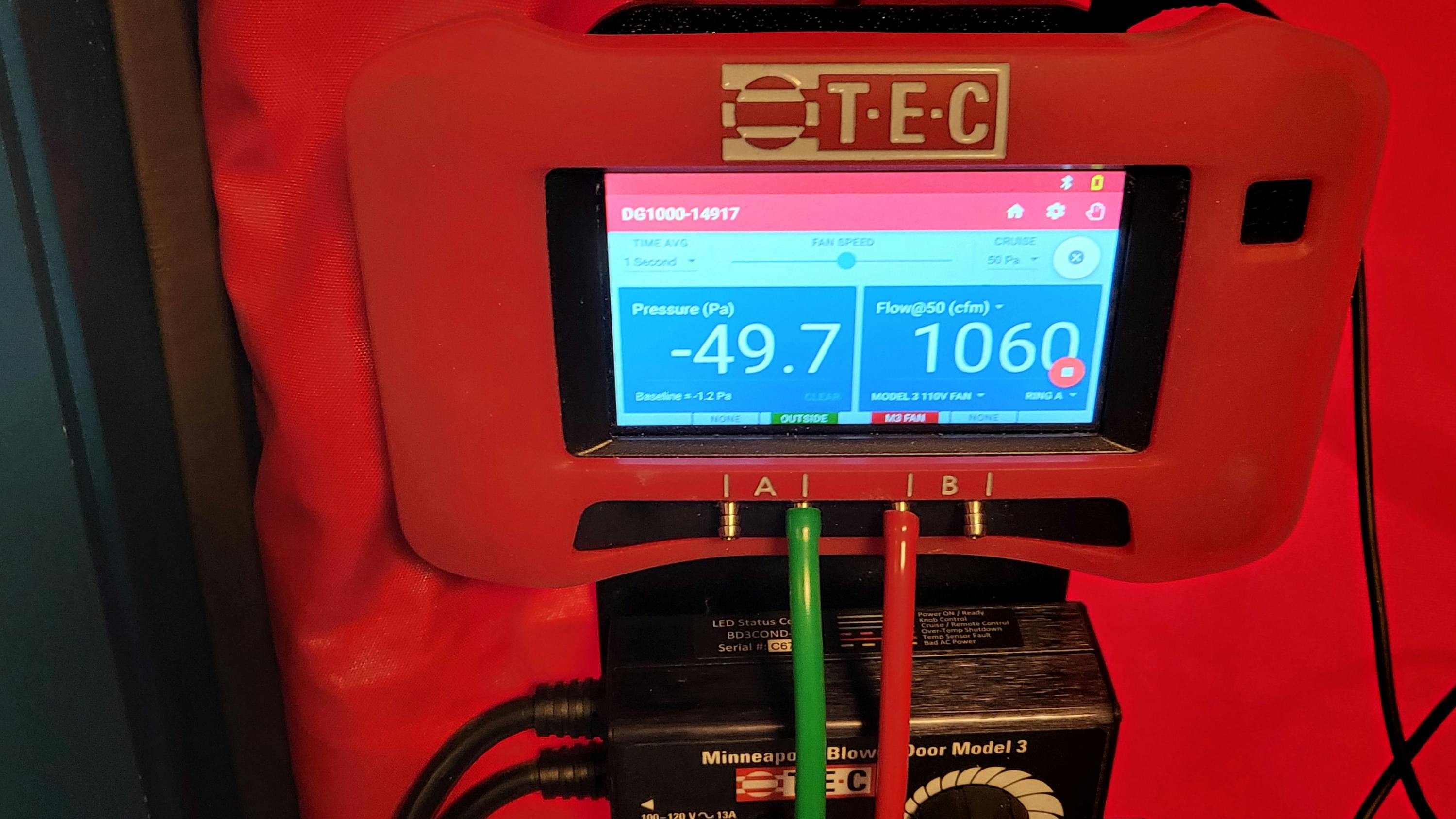 A TEC DG-1000 manometer showing my building leakage after air sealing.