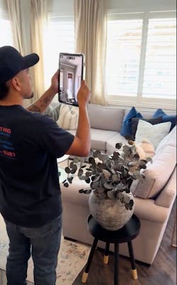 Photo 2: A technician using Scanning a home using Conduit Tech. Photo 2: A technician using Scanning a home using Conduit Tech.