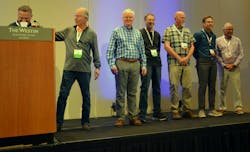 John Claybourn (at podium) introduced the ICE Group founders, From left: Bill Flynn; John Bevington; Bob Wilken; R. Scott Tracy; Scott Royer; Brad Bolino. John Claybourn (at podium) introduced the ICE Group founders, From left: Bill Flynn; John Bevington; Bob Wilken; R. Scott Tracy; Scott Royer; Brad Bolino.