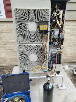 Photo 1. Pulling a vacuum on a Daikin Skyair heat pump. Photo 1. Pulling a vacuum on a Daikin Skyair heat pump.