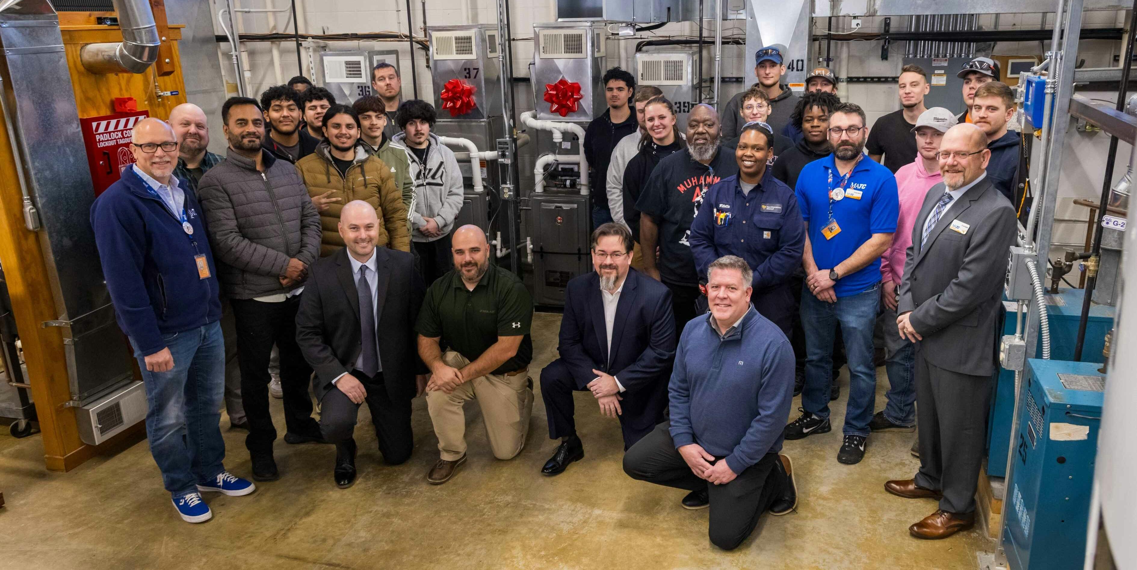 Representatives from Rheem, Design Air and Milwaukee Area Technical College gather for a celebratory photo.