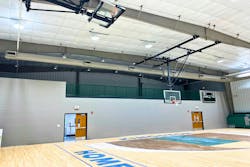 The new addition houses a new performance gymnasium with mezzanine and support spaces. The new addition houses a new performance gymnasium with mezzanine and support spaces.