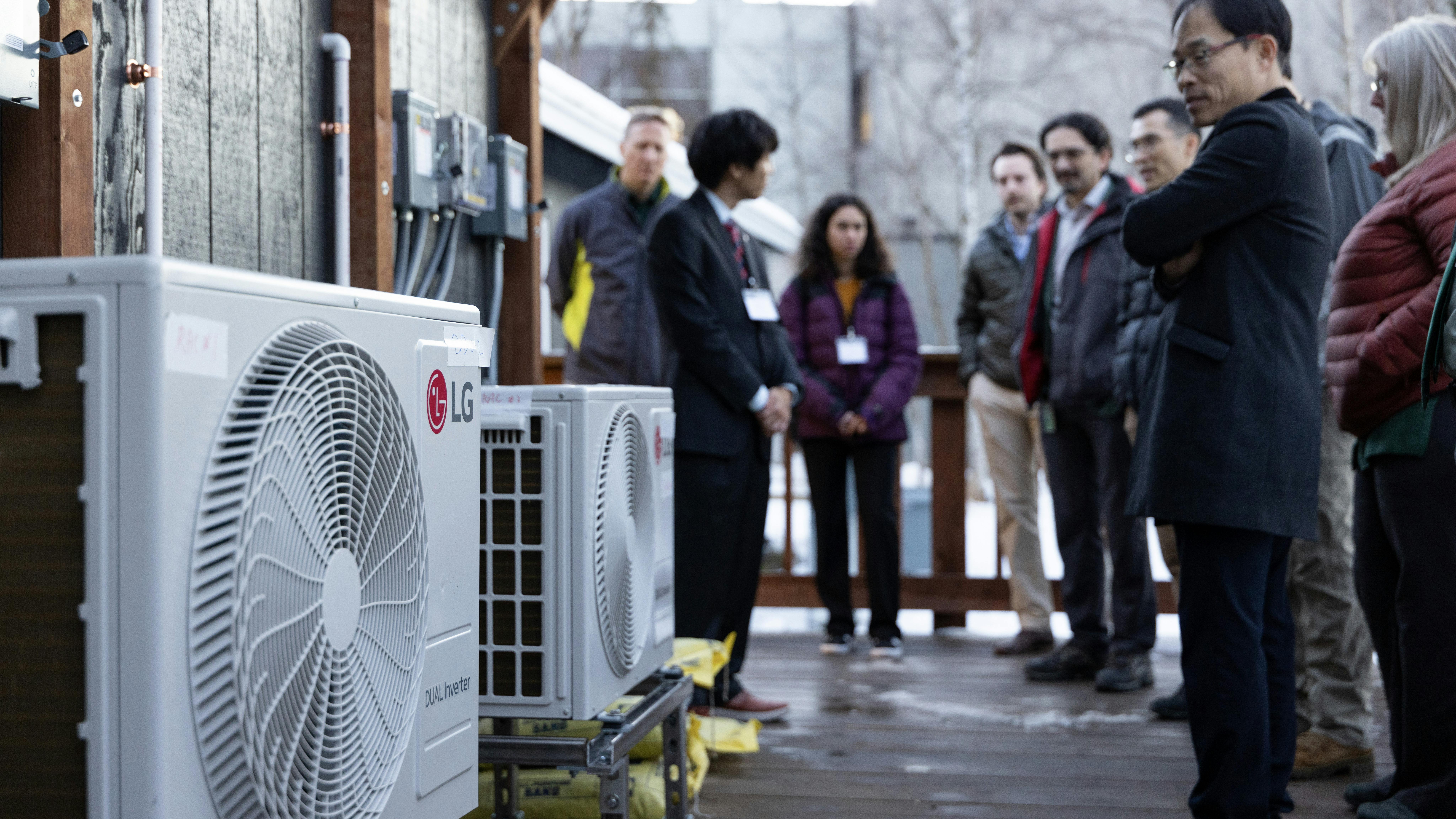 Guests to the ribbon cutting view working LG units.