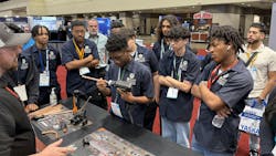 Students learning about new tools at the NAVAC booth. Students learning about new tools at the NAVAC booth.