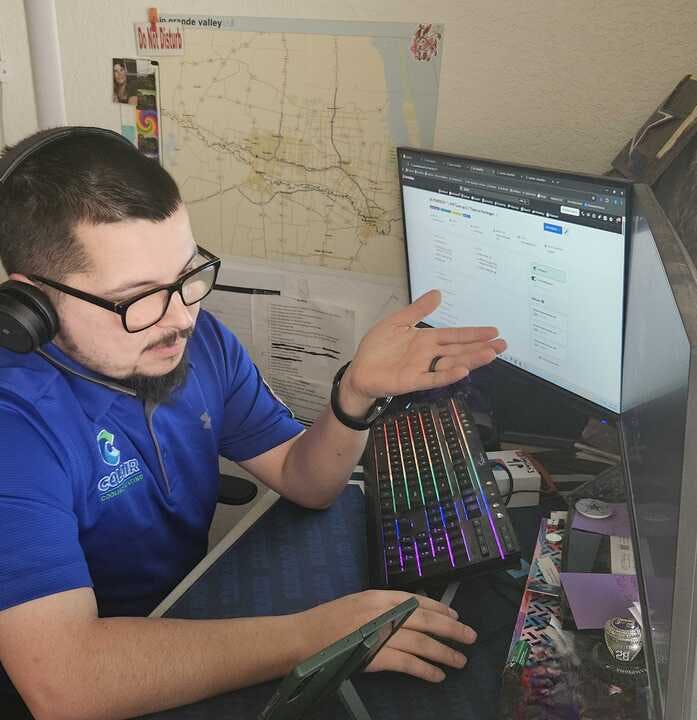 One of Colair Inc.'s remote dispatchers hard at work on the phone.