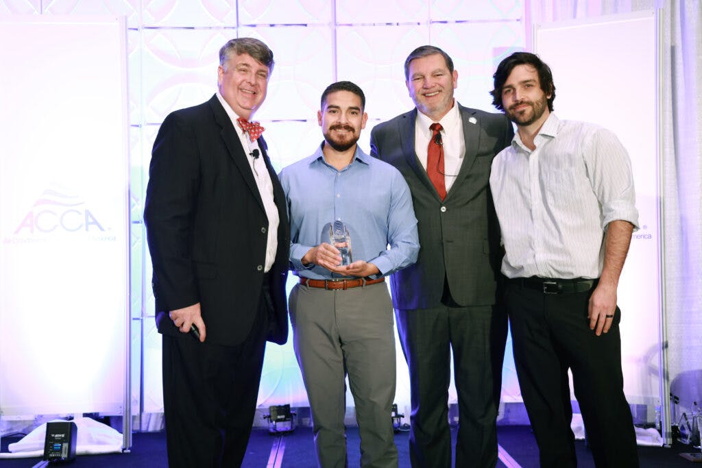 Josh Aguirre, of RighTime Home Services, shows off his Service Manager of the Year award.