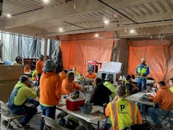 P1 Construction holds a safety meeting with employees. P1 Construction holds a safety meeting with employees.