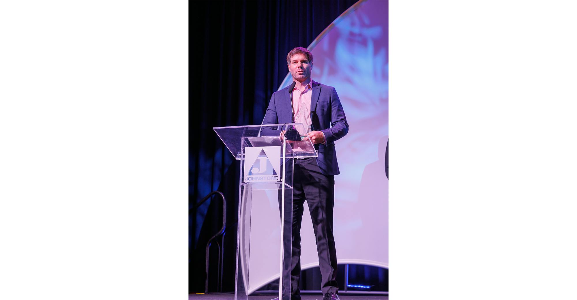 Nidec&rsquo;s Morgan Silvey accepts the Leadership Award at Johnstone Supply&rsquo;s Spring Meeting and Trade Show.