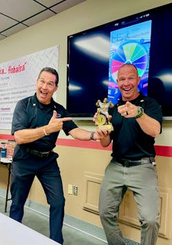 Lou Hobaica (left) celebrates the monthly sales champion award with his son, Andy Hobaica (right). Lou Hobaica (left) celebrates the monthly sales champion award with his son, Andy Hobaica (right).