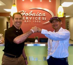 Lou Hobaica (left) celebrates a new employee, Grayson Vu (right), after his graduation from Hobaica Services' 8-week apprenticeship program. Lou Hobaica (left) celebrates a new employee, Grayson Vu (right), after his graduation from Hobaica Services' 8-week apprenticeship program.
