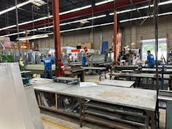 Welsch Heating & Cooling employees at work in the sheet metal fabrication shop. Welsch Heating & Cooling employees at work in the sheet metal fabrication shop.