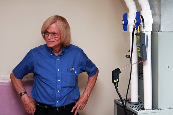 Jim Davis performing a combustion test on a Trane furnace.