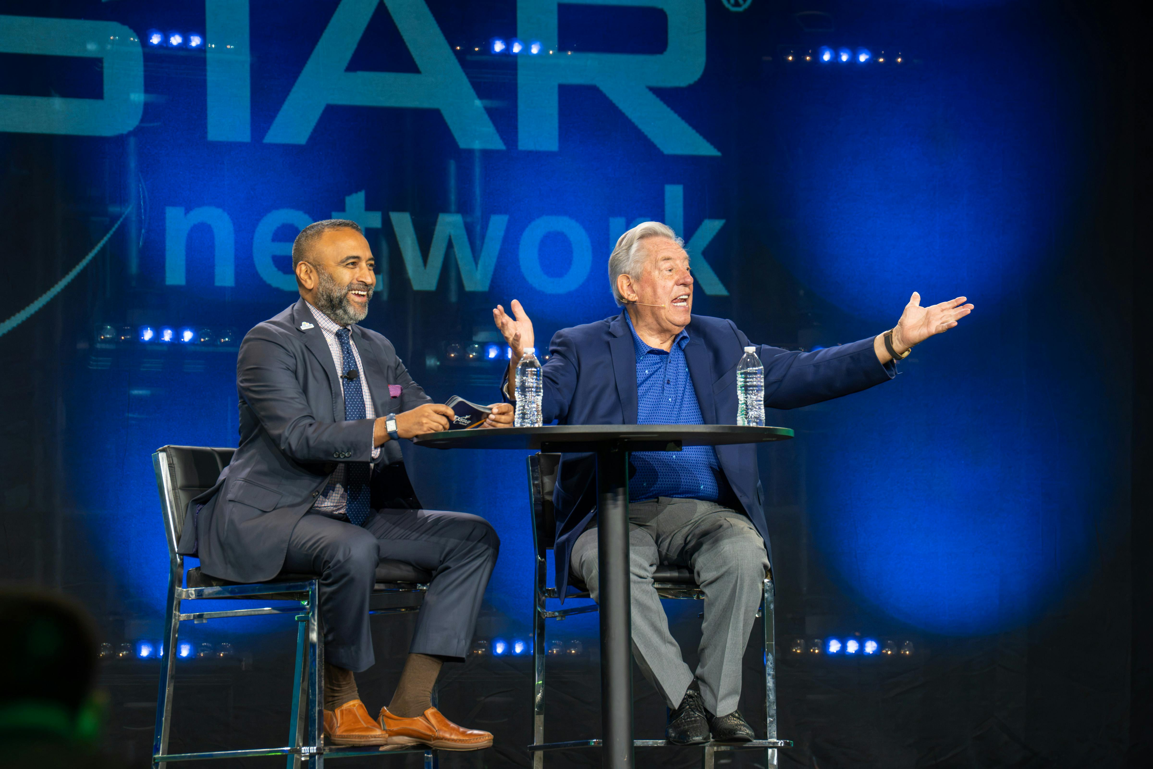 Nexstar Network President &amp; CEO Julian Scadden interviews John Maxwell on the Super Meeting stage.